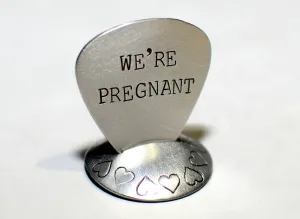 We’re Pregnant Guitar Pick for a Rocking Surprise in your choice of metals